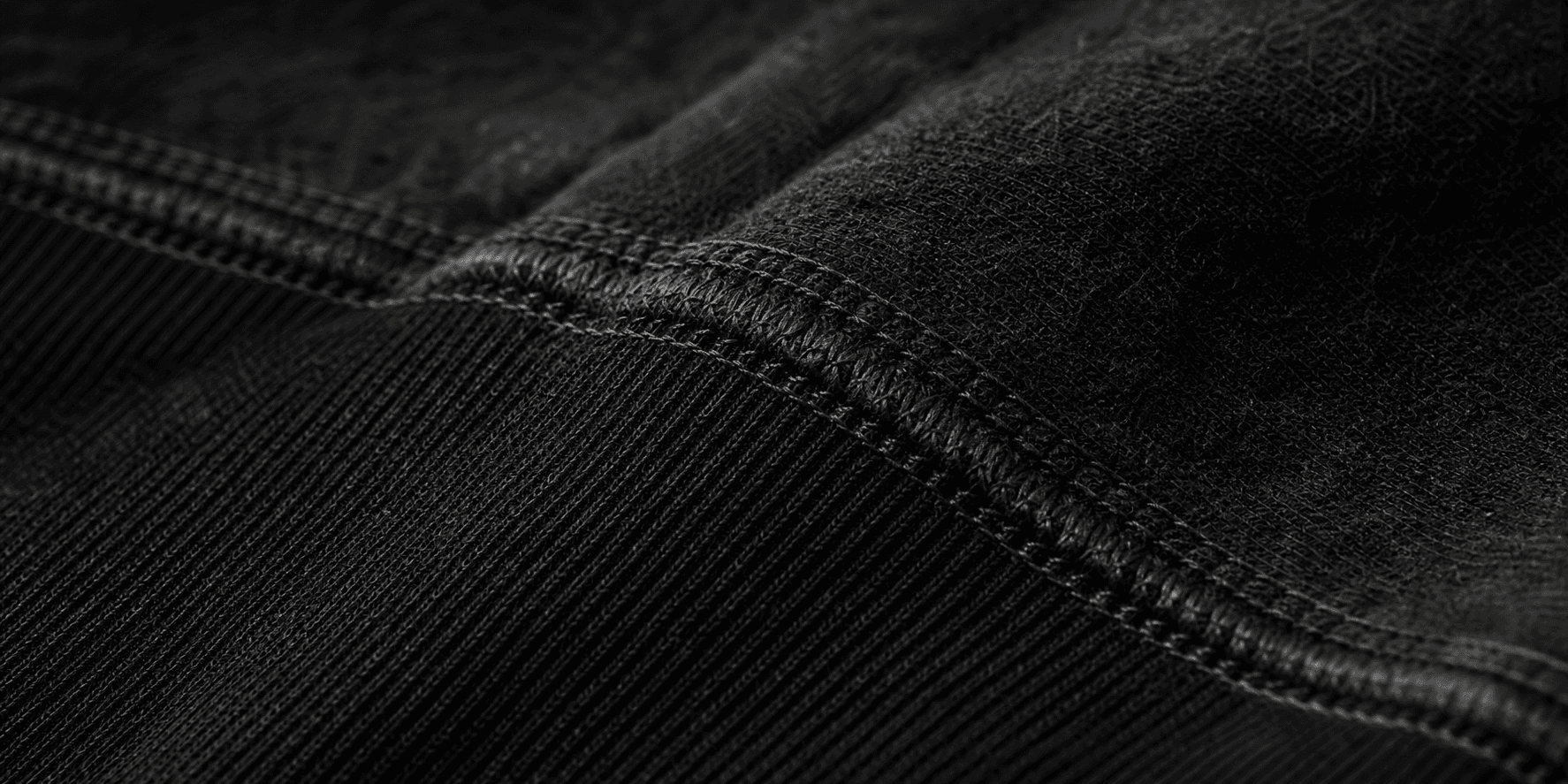 Close-up of black LEJJA EFFECTS fabric stitching