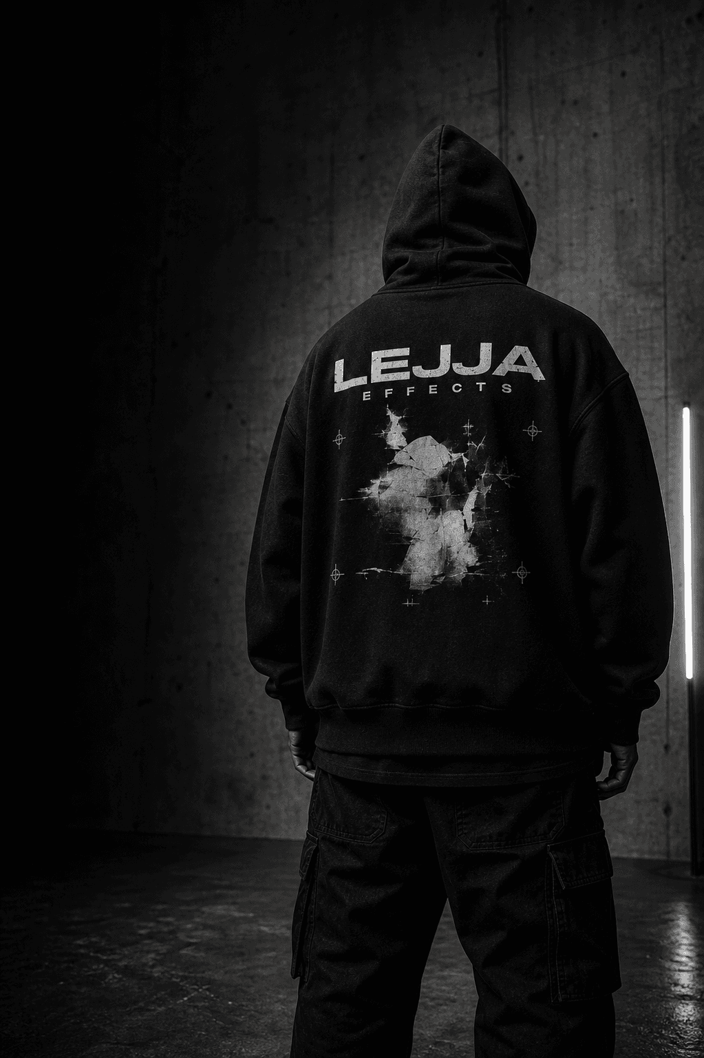 Black LEJJA EFFECTS hoodie in a concrete studio